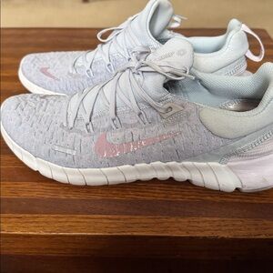 Nike Women’s Light Gray Knit Training Shoes with Pink Swoosh